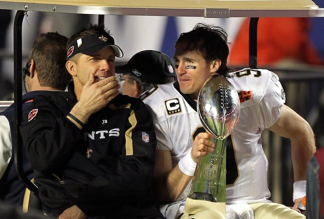 MIAMI GARDENS, FL - FEBRUARY 07:  Head coach Sean Payton of the New Orleans Saints and quarterback Drew Brees #9 leave the field in a golf cart after defeating the Indianapolis Colts during Super Bowl XLIV on February 7, 2010 at Sun Life Stadium in Miami Gardens, Florida.  (Photo by Ezra Shaw/Getty Images)