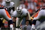 DENVER - SEPTEMBER 16:  Tommy Kelly #93 of the Oakland Raiders on the line of scrimmage as the Denver Broncos defeated the Oakland Raiders 23-20 in overtime during week two NFL action at Invesco Field at Mile High on September 16, 2007 in Denver, Colorado.  (Photo by Doug Pensinger/Getty Images)
