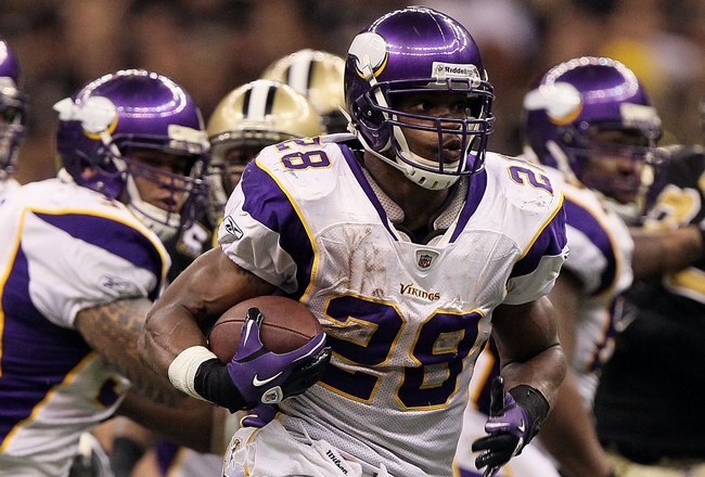 NEW ORLEANS - JANUARY 24:  Adrian Peterson #28 of the Minnesota Vikings runs the ball againsnt the New Orleans Saints during the NFC Championship Game at the Louisiana Superdome on January 24, 2010 in New Orleans, Louisiana. The Saints won 31-28 in overtime.  (Photo by Jed Jacobsohn/Getty Images)