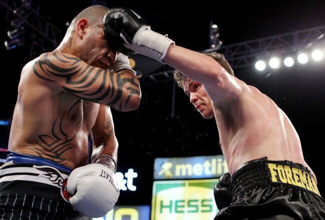 NEW YORK - JUNE 05:  Yuri Foreman (R) throws a left to the face of Miguel Cotto of Puerto Rico during the WBA world super welterweight title fight on June 5, 2010 at Yankee Stadium in the Bronx borough of New York City.  Cotto wins by TKO in the ninth round. (Photo by Al Bello/Getty Images)