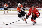 CHICAGO - MAY 29:  Niklas Hjalmarsson #4 of the Chicago Blackhawks defends against Danny Briere #48 of the Philadelphia Flyers in Game One of the 2010 NHL Stanley Cup Final at the United Center on May 29, 2010 in Chicago, Illinois.  (Photo by Bruce Bennett/Getty Images)