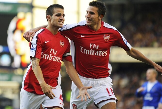 LIVERPOOL, ENGLAND - AUGUST 15:   Francesc Fabregas of Arsenal is congratulated by teammate Robin van Persie (R) after scoring his team's fourth goal during the Barclays Premier League match between Everton and Arsenal at Goodison Park on August 15, 2009 in Liverpool, England. (Photo by Michael Regan/Getty Images)