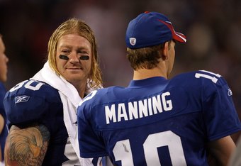 EAST RUTHERFORD, NJ - SEPTEMBER 30:  Jeremy Shockey #80 and Eli Manning #10 of the New York Giants look on against the Philadelphia Eagles at Giants Stadium on September 30, 2007 in East Rutherford, New Jersey.  (Photo by Nick Laham/Getty Images)