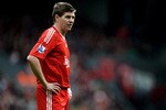 LIVERPOOL, ENGLAND - MAY 02:  A dejected Steven Gerrard of Liverpool looks on as his team heads towards a 2-0 defeat during the Barclays Premier League match between Liverpool and Chelsea at Anfield on May 2, 2010 in Liverpool, England.  (Photo by Laurence Griffiths/Getty Images)