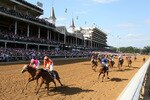 LOUISVILLE, KY - APRIL 30:  (L-R) Blind Luck, ridden by jockey Rafael Bejarano, crosses the finish line ahead of Evening Jewel, ridden by jockey Kent Desormeaux, to win the 136th running of the Kentucky Oaks at Churchill Downs on April 30, 2010 in Louisville, Kentucky.  (Photo by Jamie Squire/Getty Images)