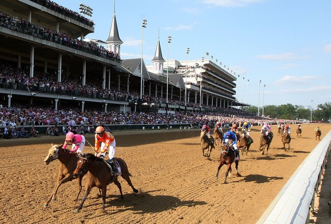 LOUISVILLE, KY - APRIL 30:  (L-R) Blind Luck, ridden by jockey Rafael Bejarano, crosses the finish line ahead of Evening Jewel, ridden by jockey Kent Desormeaux, to win the 136th running of the Kentucky Oaks at Churchill Downs on April 30, 2010 in Louisville, Kentucky.  (Photo by Jamie Squire/Getty Images)