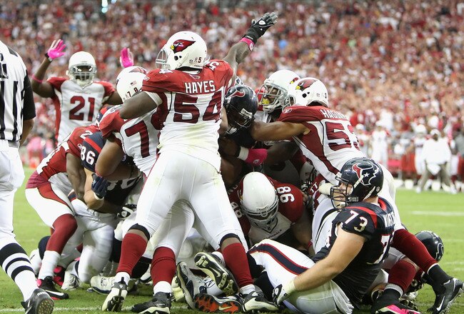 GLENDALE, AZ - OCTOBER 11: Linebacker Gerald Hayes #54 of the Arizona Cardinals signals for a turnover after the Houston Texans were stopped on a fourth and goal during the final moments of the NFL game at the Universtity of Phoenix Stadium on October 11, 2009 in Glendale, Arizona. (Photo by Christian Petersen/Getty Images)