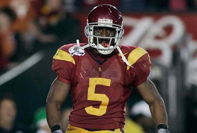 PASADENA, CA - JANUARY 04:  Running back Reggie Bush #5 of the USC Trojans reacts after scoring a 26-yard touchdown in the fourth quarter against the Texas Longhorns during the BCS National Championship Rose Bowl Game on January 4, 2006 in Pasadena, California.  (Photo by Donald Miralle/Getty Images)