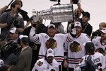PHILADELPHIA - JUNE 09:  Marian Hossa #81 of the Chicago Blackhawks hoists the Stanley Cup after teammate Patrick Kane #88 scored the game-winning goal in overtime to defeat the Philadelphia Flyers 4-3 and win the Stanley Cup in Game Six of the 2010 NHL Stanley Cup Final at the Wachovia Center on June 9, 2010 in Philadelphia, Pennsylvania.  (Photo by Al Bello/Getty Images)