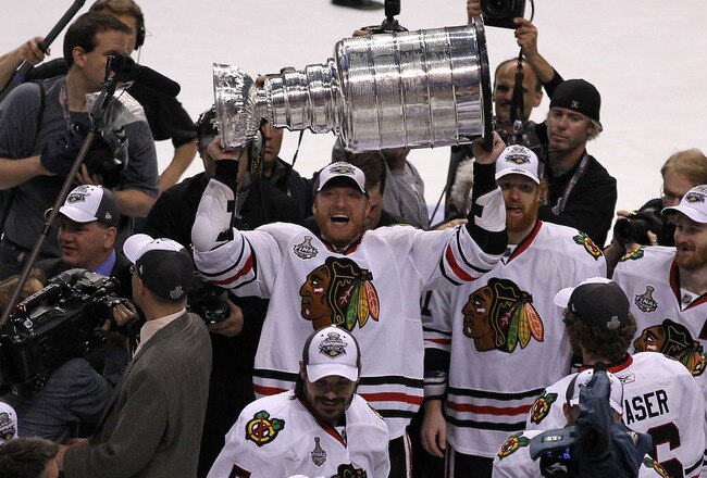 PHILADELPHIA - JUNE 09:  Marian Hossa #81 of the Chicago Blackhawks hoists the Stanley Cup after teammate Patrick Kane #88 scored the game-winning goal in overtime to defeat the Philadelphia Flyers 4-3 and win the Stanley Cup in Game Six of the 2010 NHL Stanley Cup Final at the Wachovia Center on June 9, 2010 in Philadelphia, Pennsylvania.  (Photo by Al Bello/Getty Images)