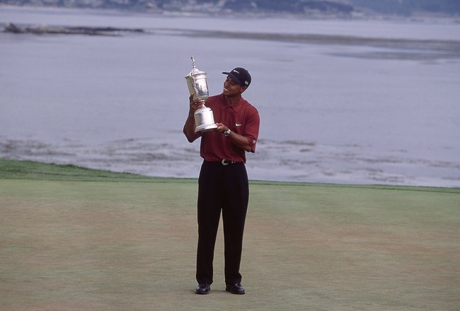 18 Jun 2000:  Tiger Woods of the USA poses with the winning trophy after winning the 100th US Open held at the Pebble Beach Golf Links, in Pebble Beach, California. \ Mandatory Credit: David Cannon /Allsport