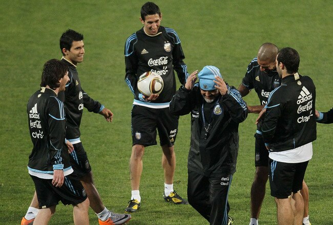 PRETORIA, SOUTH AFRICA - JUNE 10:  Argentina's head coach Diego Maradona is pushed and slapped by players after letting the ball hit the ground in a passing drill during a team training session on June 10, 2010 in Pretoria, South Africa.  (Photo by Chris McGrath/Getty Images)