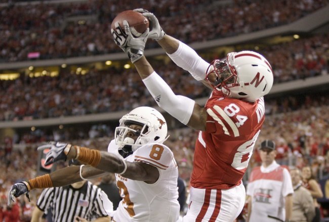 ARLINGTON, TX - DECEMBER 5: Brandon Kinnie #84 of the Nebraska Cornhuskers leaps for the catch against Chykie Brown #8 of the Texas Longhorns during Big 12 Football Championship game at Cowboys Stadium on December 5, 2009 in Arlington, Texas. (Photo by Jamie Squire/Getty Images)
