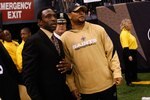 NEW ORLEANS - JANUARY 16:  Former NBA head coach Avery Johnson (L) and Deuce McAllister of the New Orleans Saints stand on the field against the Arizona Cardinals during the NFC Divisional Playoff Game at Louisana Superdome on January 16, 2010 in New Orleans, Louisiana. The Saints won 45-14.  (Photo by Chris Graythen/Getty Images)