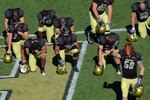 BOULDER, CO - NOVEMBER 07:  BJ Beatty #59 and members of the Colorado Buffaloes pause in the endzone prior to facing the Texas A&M Aggies during NCAA college football action at Folsom Field on November 7, 2009 in Boulder, Colorado. Colorado defeated Texas A&M 35-34.  (Photo by Doug Pensinger/Getty Images)