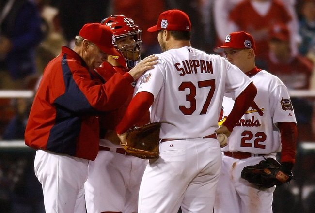 ST LOUIS - OCTOBER 26:  Starting pitcher Jeff Suppan #37 and pitching coach Dave Duncan of the St. Louis Cardinals talk on the mound against the Detroit Tigers during Game Four of the 2006 World Series on October 26, 2006 at Busch Stadium in St. Louis, Missouri.  (Photo by Jamie Squire/Getty Images)
