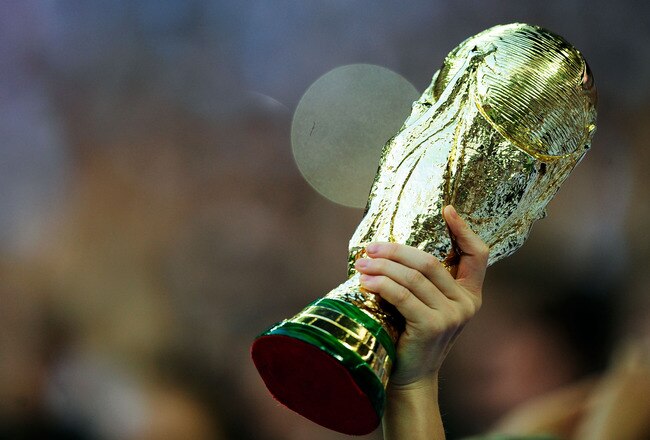 LONDON, ENGLAND - MAY 24: A fan holds aloft a replica of the FIFA World Cup Trophy during the International Friendly match between England and Mexico at Wembley Stadium on May 24, 2010 in London, England.  (Photo by Jamie McDonald/Getty Images)