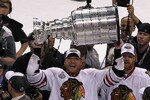 PHILADELPHIA - JUNE 09:  Marian Hossa #81 of the Chicago Blackhawks hoists the Stanley Cup after teammate Patrick Kane #88 scored the game-winning goal in overtime to defeat the Philadelphia Flyers 4-3 and win the Stanley Cup in Game Six of the 2010 NHL Stanley Cup Final at the Wachovia Center on June 9, 2010 in Philadelphia, Pennsylvania.  (Photo by Al Bello/Getty Images)