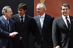 MADRID, SPAIN - APRIL 16: (L-R) Florentino Perez, president of Real Madrid, Raul Gonzalez of Real Madrid, Johan Cruyff, honorary president of Barcelona, Joan Laporta, president of Barcelona, Alberto Ruiz Gallardon, mayor of Madrid, Francisco Gento, former player of Real Madrid, Angel Maria Villar, vice president of UEFA and Emilio Butragueno, Champions League final match ambassador pose during the UEFA Champions League trophy handover ceremony at Palacio de Cibeles on April 16, 2010 in Madrid, Spain. (Photo by Angel Martinez/Getty Images)
