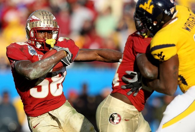 JACKSONVILLE, FL - JANUARY 01:  Running back Jermaine Thomas #38 of the Florida State Seminoles looks for room to run against the West Virginia Mountaineers during the Konica Minolta Gator Bowl on January 1, 2010 at Jacksonville Municipal Stadium in Jacksonville, Florida. Florida State defeated West Virginia 33-21 in Bobby Bowden's last game as a head coach for the Seminoles.  (Photo by Doug Benc/Getty Images)