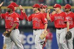 SEATTLE - JUNE 06:  Members of the Los Angeles Angels of Anaheim including Howard Kendrick #47, Kevin Frandsen #18, and Robb Quinlan #39 celebrate after defeating the Seattle Mariners 9-4 at Safeco Field on June 6, 2010 in Seattle, Washington. (Photo by Otto Greule Jr/Getty Images)