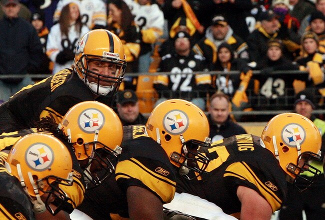 PITTSBURGH - DECEMBER 27:  Ben Roethlisberger #7 of the Pittsburgh Steelers lines up under teammate center Justin Hartwig #62 before the snap during the game against the Baltimore Ravens at Heinz Field on December 27, 2009 in Pittsburgh, Pennsylvania.  (Photo by Karl Walter/Getty Images)