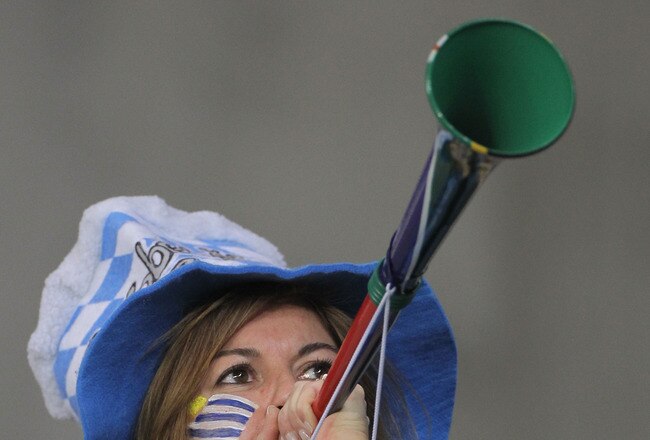 CAPE TOWN, SOUTH AFRICA - JUNE 11:  A Uruguay fan blows a vuvuzela prior to the 2010 FIFA World Cup South Africa Group A match between Uruguay and France at Green Point Stadium on June 11, 2010 in Cape Town, South Africa.  (Photo by Doug Pensinger/Getty Images)
