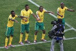 JOHANNESBURG, SOUTH AFRICA - JUNE 11:  Siphiwe Tshabalala (C) of South Africa celebrates scoring the first goal with team mates during the 2010 FIFA World Cup South Africa Group A match between South Africa and Mexico at Soccer City Stadium on June 11, 2010 in Johannesburg, South Africa.  (Photo by Christof Koepsel/Getty Images)