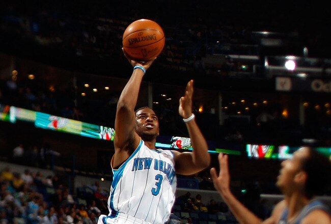 NEW ORLEANS - MARCH 31:  (EDITORS NOTE: Image was created using a variable planed lens) Chris Paul #3 of the New Orleans Hornets shoots the ball over Shaun Livingston #2 of the Washington Wizards at New Orleans Arena on March 31, 2010 in New Orleans, Louisiana.  The Wizards defeated the Hornets 96-91.  NOTE TO USER: User expressly acknowledges and agrees that, by downloading and/or using this Photograph, User is consenting to the terms and conditions of the Getty Images License Agreement.  (Photo by Chris Graythen/Getty Images)