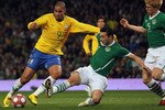 LONDON, ENGLAND - MARCH 02:  Adriano (L) of Brazil contests with Stephen Kelly (C) and Paul McShane of Ireland during the International Friendly match between Republic of Ireland and Brazil played at Emirates Stadium on March 2, 2010 in London, England.  (Photo by Hamish Blair/Getty Images)