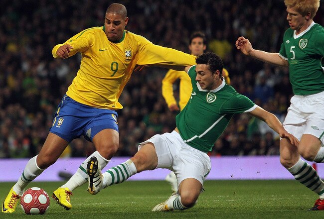 LONDON, ENGLAND - MARCH 02:  Adriano (L) of Brazil contests with Stephen Kelly (C) and Paul McShane of Ireland during the International Friendly match between Republic of Ireland and Brazil played at Emirates Stadium on March 2, 2010 in London, England.  (Photo by Hamish Blair/Getty Images)