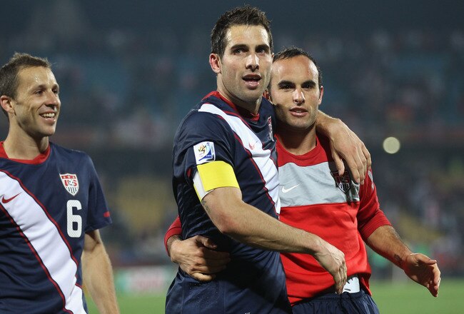 RUSTENBURG, SOUTH AFRICA - JUNE 12:  Carlos Bocanegra of the United States (C) celebrates with Steve Cherundolo (L) and Landon Donovan (R) at the final whistle during the 2010 FIFA World Cup South Africa Group C match between England and USA at the Royal Bafokeng Stadium on June 12, 2010 in Rustenburg, South Africa.  (Photo by Phil Cole/Getty Images)