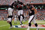 MIAMI - DECEMBER 27:  Wide receivers Andre Johnson #80 and Jacoby Jones #12 of the Houston Texans after Johnson scored a touchdown against the Miami Dolphins at Land Shark Stadium on December 27, 2009 in Miami, Florida. The Texans defeated the Dolphins 27-20. (Photo by Doug Benc/Getty Images)