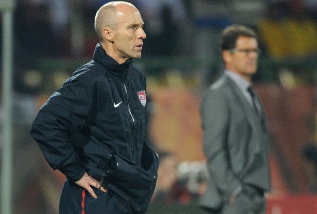 RUSTENBURG, SOUTH AFRICA - JUNE 12: Bob Bradley head coach of USA watches from the touchline in front of Fabio Capello manager of England during the 2010 FIFA World Cup South Africa Group C match between England and USA at the Royal Bafokeng Stadium on June 12, 2010 in Rustenburg, South Africa.  (Photo by Kevork Djansezian/Getty Images)