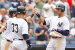 NEW YORK - JUNE 12:  Derek Jeter #2 of the New York Yankees is greeted at home plate after hitting his second home run of the game against the Houston Astros on June 12, 2010 at Yankee Stadium in the Bronx borough of New York City. Yankees defeat the Astros 9-3. (Photo by Mike Stobe/Getty Images)