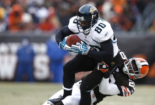 CLEVELAND - JANUARY 03:  Mike Thomas #80 of the Jacksonville Jaguars is dragged down by Mike Adams #20 of the Cleveland Browns at Cleveland Browns Stadium on January 3, 2010 in Cleveland, Ohio.  (Photo by Matt Sullivan/Getty Images)