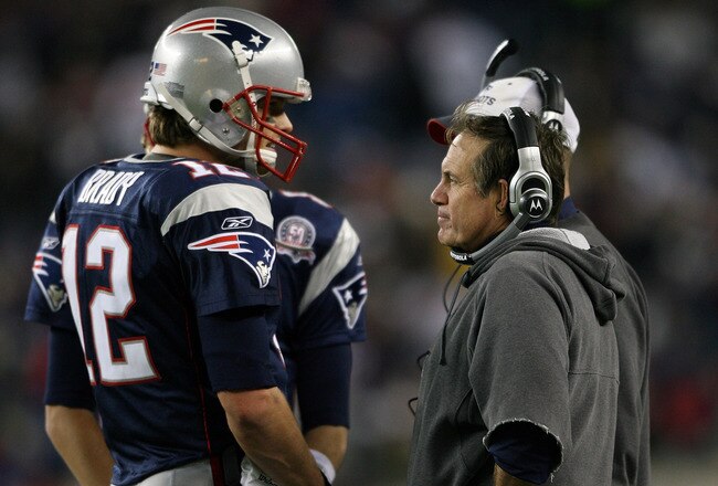 FOXBORO, MA - NOVEMBER 22:  Tom Brady #12 of the New England Patriots talks with head coach Bill Belichick in fourth quarter against the New York Jets on November 22, 2009 at Gillette Stadium in Foxboro, Massachusetts. The Patriots defeated the Jets 31-14.  (Photo by Elsa/Getty Images)