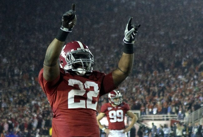 PASADENA, CA - JANUARY 07:  Running back Mark Ingram #22 of the Alabama Crimson Tide celebrates after an extra point during the Citi BCS National Championship game against the Texas Longhorns at the Rose Bowl on January 7, 2010 in Pasadena, California. The Crimson Tide defeated the Longhorns 37-21.  (Photo by Stephen Dunn/Getty Images)
