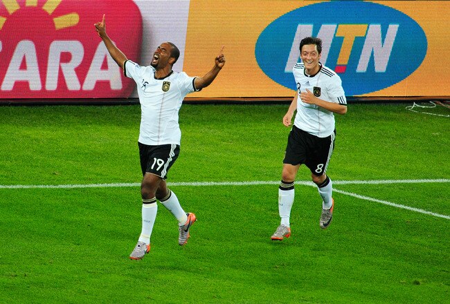 DURBAN, SOUTH AFRICA - JUNE 13:  Cacau of Germany celebrates scoring his side's fourth goal with team mate Mesut Oezil (R) during the 2010 FIFA World Cup South Africa Group D match between Germany and Australia at Durban Stadium on June 13, 2010 in Durban, South Africa.  (Photo by Jamie McDonald/Getty Images)