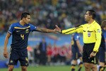DURBAN, SOUTH AFRICA - JUNE 13:  Referee Marco Rodriguez asks Tim Cahill of Australia to leave the pitch after showing a straight red card following a tackle on Bastian Schweinsteiger of Germany during the 2010 FIFA World Cup South Africa Group D match between Germany and Australia at Durban Stadium on June 13, 2010 in Durban, South Africa.  (Photo by Doug Pensinger/Getty Images)