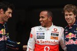MONTREAL - JUNE 12:  Pole sitter Lewis Hamilton (C) of Great Britain and McLaren Mercedes celebrates in parc ferme with second placed Mark Webber (L) of Australia and Red Bull Racing and third placed Sebastian Vettel (R) of Germany and Red Bull Racing following qualifying for the Canadian Formula One Grand Prix at the Circuit Gilles Villeneuve on June 12, 2010 in Montreal, Canada.  (Photo by Bryn Lennon/Getty Images)