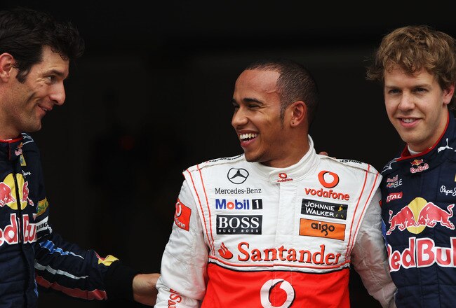 MONTREAL - JUNE 12:  Pole sitter Lewis Hamilton (C) of Great Britain and McLaren Mercedes celebrates in parc ferme with second placed Mark Webber (L) of Australia and Red Bull Racing and third placed Sebastian Vettel (R) of Germany and Red Bull Racing following qualifying for the Canadian Formula One Grand Prix at the Circuit Gilles Villeneuve on June 12, 2010 in Montreal, Canada.  (Photo by Bryn Lennon/Getty Images)