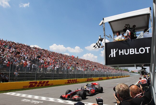 MONTREAL - JUNE 13:  Lewis Hamilton of Great Britain and McLaren Mercedes celebrates as he wins the Canadian Formula One Grand Prix at the Circuit Gilles Villeneuve on June 13, 2010 in Montreal, Canada.  (Photo by Bryn Lennon/Getty Images)