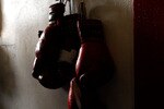 LOS ANGELES, CA - SEPTEMBER 29: Boxing gloves hang on the wall at the Urbina Westside Boxing Gym where Israel Vasquez Two-time Junior Featherweight World Champion had a workout session on September 29, 2009 in Los Angeles, California.  Vasquez will return to the ring to face Angel Priolo on October 10, 2009.  (Photo by Jacob de Golish/Getty Images)
