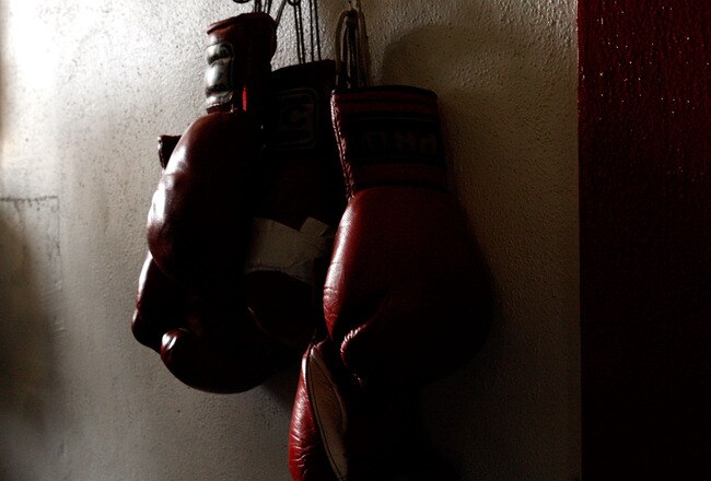 LOS ANGELES, CA - SEPTEMBER 29: Boxing gloves hang on the wall at the Urbina Westside Boxing Gym where Israel Vasquez Two-time Junior Featherweight World Champion had a workout session on September 29, 2009 in Los Angeles, California.  Vasquez will return to the ring to face Angel Priolo on October 10, 2009.  (Photo by Jacob de Golish/Getty Images)