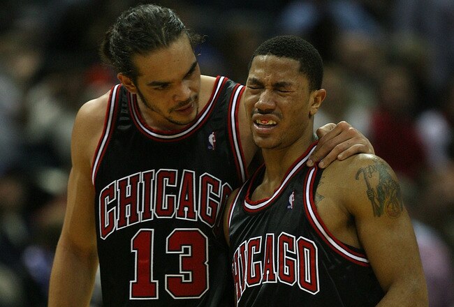MILWAUKEE - NOVEMBER 30: Joakim Noah #13 of the Chicago Bulls consoles teammate Derrick Rose #1 during a time-out after Rose was fouled during a game against the Milwaukee Bucks at the Bradley Center on November 30, 2009 in Milwaukee, Wisconsin. The Bucks defeated the Bulls 99-97. NOTE TO USER: User expressly acknowledges and agrees that, by downloading and/or using this Photograph, User is consenting to the terms and conditions of the Getty Images License Agreement. (Photo by Jonathan Daniel/Getty Images)