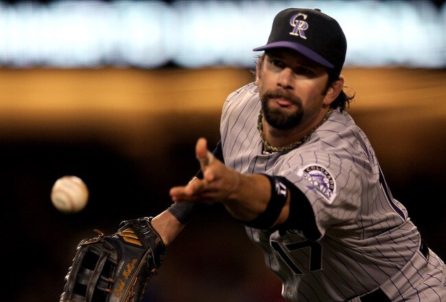 LOS ANGELES - MAY 8:  First baseman Todd Helton #17 of the Colorado Rockies flips the ball to first to force out Matt Kemp of the Los Angeles Dodgers to end the fifth inning on May 8, 2010 at Dodger Stadium in Los Angeles, California.  (Photo by Stephen Dunn/Getty Images)