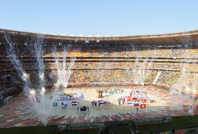 JOHANNESBURG, SOUTH AFRICA - JUNE 11:  Performers display the flags of all the teams competing during the Opening Ceremony ahead of the 2010 FIFA World Cup South Africa Group A match between South Africa and Mexico at Soccer City Stadium on June 11, 2010 in Johannesburg, South Africa.  (Photo by David Cannon/Getty Images)