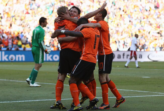 JOHANNESBURG, SOUTH AFRICA - JUNE 14:  Dirk Kuyt of the Netherlands celebrates with team mates after scoring the second goal during the 2010 FIFA World Cup Group E match between Netherlands and Denmark at Soccer City Stadium on June 14, 2010 in Johannesburg, South Africa.  (Photo by Streeter Lecka/Getty Images)