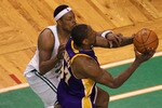 BOSTON - JUNE 13:  Ron Artest #37 of the Los Angeles Lakers goes to the basket against Paul Pierce #34 of the Boston Celtics during Game Five of the 2010 NBA Finals on June 13, 2010 at TD Garden in Boston, Massachusetts. The Celtics won 92-86. NOTE TO USER: User expressly acknowledges and agrees that, by downloading and/or using this Photograph, user is consenting to the terms and conditions of the Getty Images License Agreement.  (Photo by Jim Rogash/Getty Images)